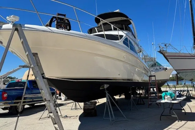 Slide: The Image of 2004 Sea Ray 420 Sedan Bridge yacht on dry dock for maintenance. - 82