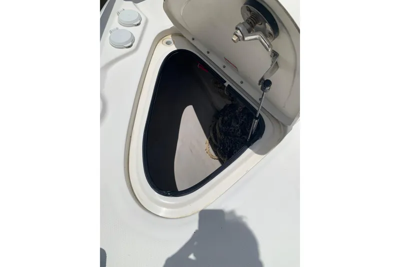 Slide: The Image of Open hatch on 2004 Sea Ray 420 Sedan Bridge, revealing storage compartment. - 20