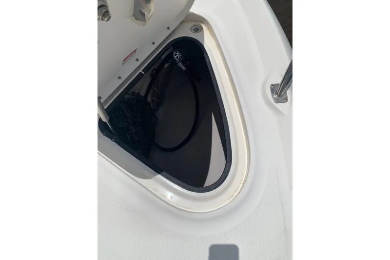Slide: The Image of Open hatch on 2004 Sea Ray 420 Sedan Bridge, showing storage compartment. - 21