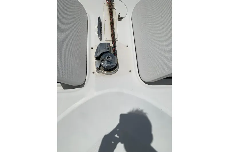 Slide: The Image of 2004 Sea Ray 420 Sedan Bridge deck with anchor winch and chain. - 22