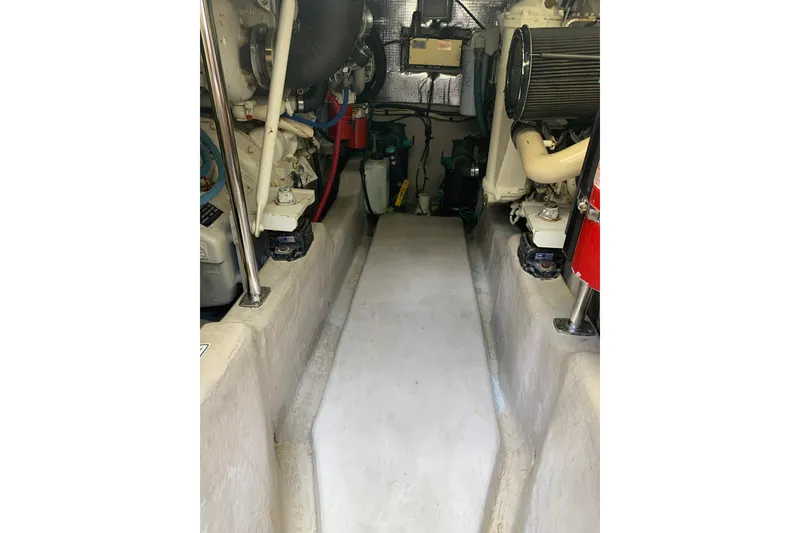 Slide: The Image of Engine room of 2004 Sea Ray 420 Sedan Bridge, showcasing mechanical components and equipment. - 41