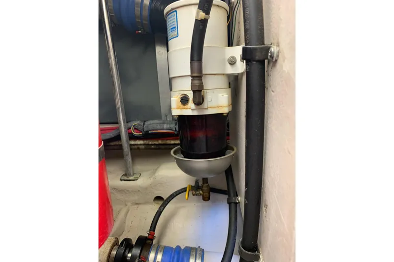 Slide: The Image of Fuel filter system in a 2004 Sea Ray 420 Sedan Bridge engine compartment. - 48