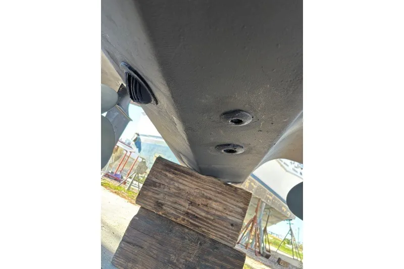 Slide: The Image of Bottom view of 2004 Sea Ray 420 Sedan Bridge hull on wooden blocks. - 90