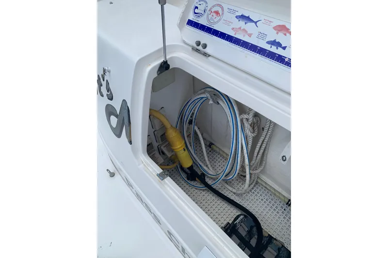 Slide: The Image of Storage compartment on a 2004 Sea Ray 420 Sedan Bridge with ropes and cables. - 50