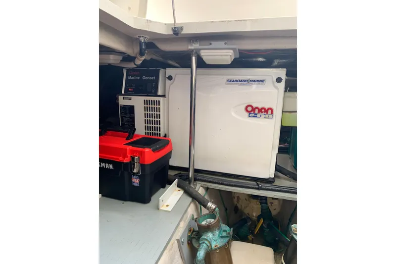 Slide: The Image of Engine room of 2004 Sea Ray 420 Sedan Bridge with Onan marine generator. - 53