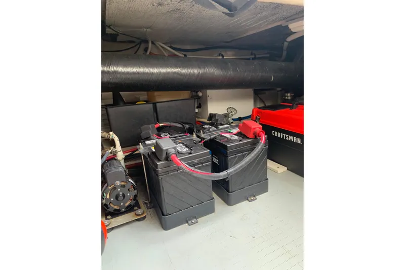 Slide: The Image of Battery compartment of a 2004 Sea Ray 420 Sedan Bridge with Craftsman toolbox. - 55