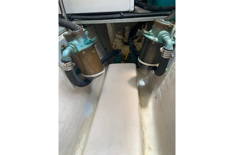 Slide: The Image of Engine compartment of a 2004 Sea Ray 420 Sedan Bridge, showing dual water filters. - 57
