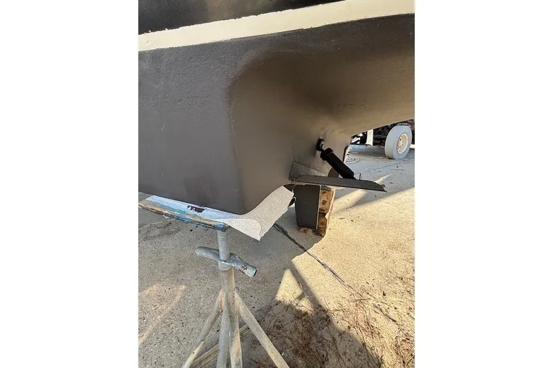 Slide: The Image of 2004 Sea Ray 420 Sedan Bridge hull on stand, showcasing underside details. - 103