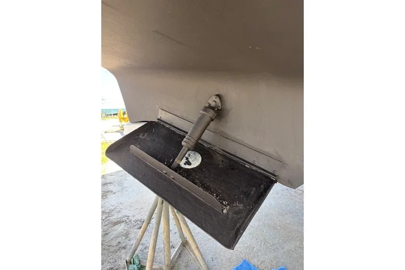 Slide: The Image of 2004 Sea Ray 420 Sedan Bridge trim tab and propeller shaft detail. - 79