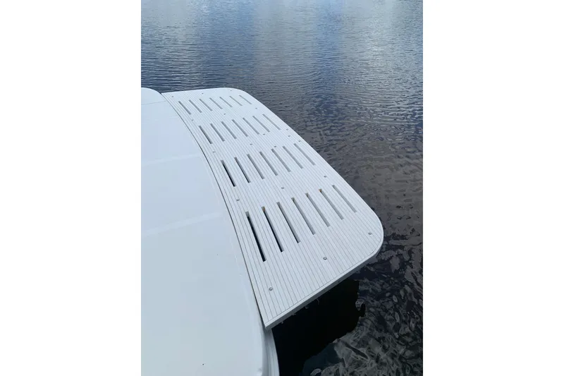 Slide: The Image of 2004 Sea Ray 420 Sedan Bridge swim platform on calm water. - 7