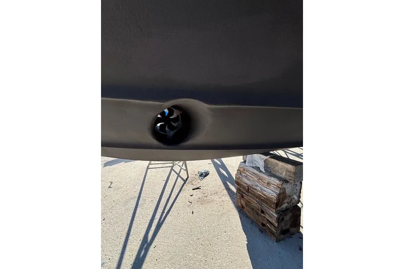 Slide: The Image of Close-up of a 2004 Sea Ray 420 Sedan Bridge hull with visible thruster. - 98