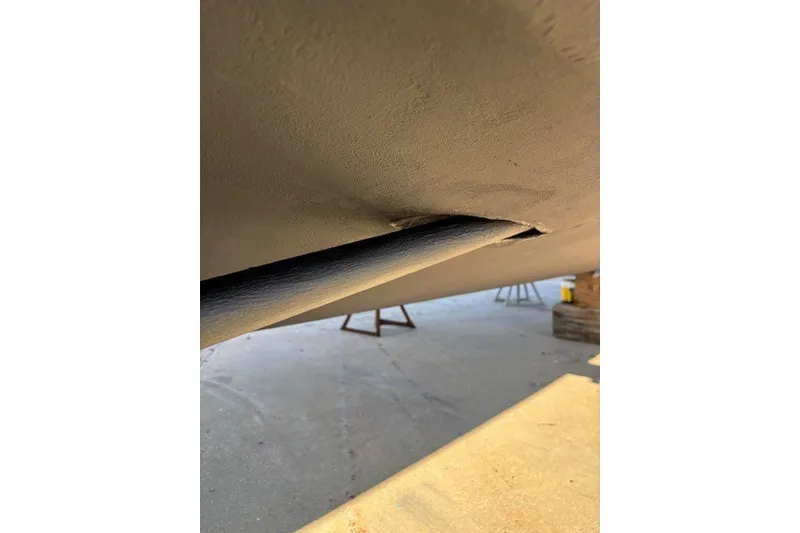 Slide: The Image of Close-up of 2004 Sea Ray 420 Sedan Bridge hull detail in dry dock. - 88