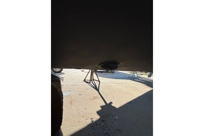 Slide: The Image of Bottom view of a 2004 Sea Ray 420 Sedan Bridge on stands. - 102