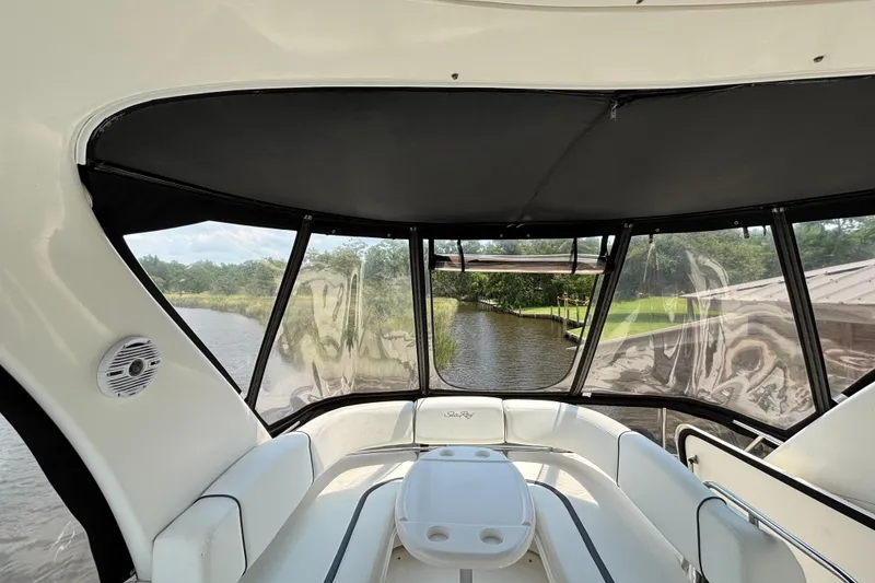 Slide: The Image of Interior view of 2004 Sea Ray 420 Sedan Bridge yacht with scenic waterway backdrop. - 67