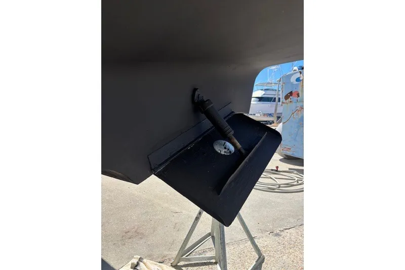 Slide: The Image of Close-up of a 2004 Sea Ray 420 Sedan Bridge boat's rudder and propeller shaft. - 80