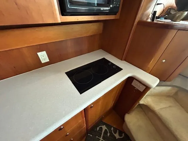 Slide: The Image of Kitchen area of the 2003 Silverton 42 Convertible yacht. - 46