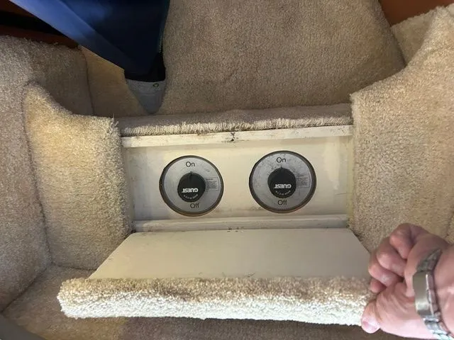 Slide: The Image of Switches in carpeted floor of a 2003 Silverton 42 Convertible boat. - 47