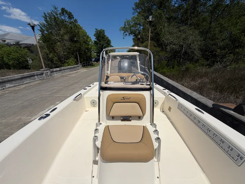 Slide: The Image of 2019 Scout 177 Sport boat docked on a sunny day. - 13
