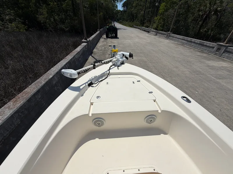 Slide: The Image of 2019 Scout 177 Sport boat parked on a road. - 14