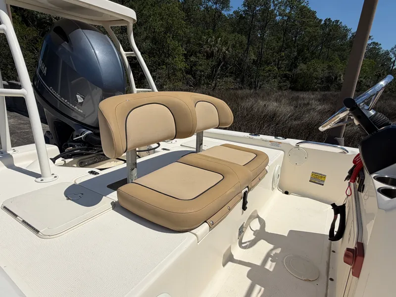 Slide: The Image of Scout 177 Sport 2019 with Yamaha engine, beige seats, parked outdoors. - 6