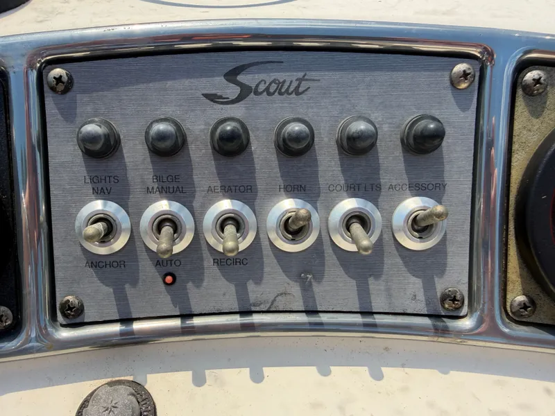 Slide: The Image of Control panel of a 2019 Scout 177 Sport boat. - 9