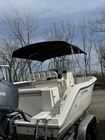 Slide: The Image of 2015 Cobia 201 Center Console boat on trailer, Yamaha engine. - 2