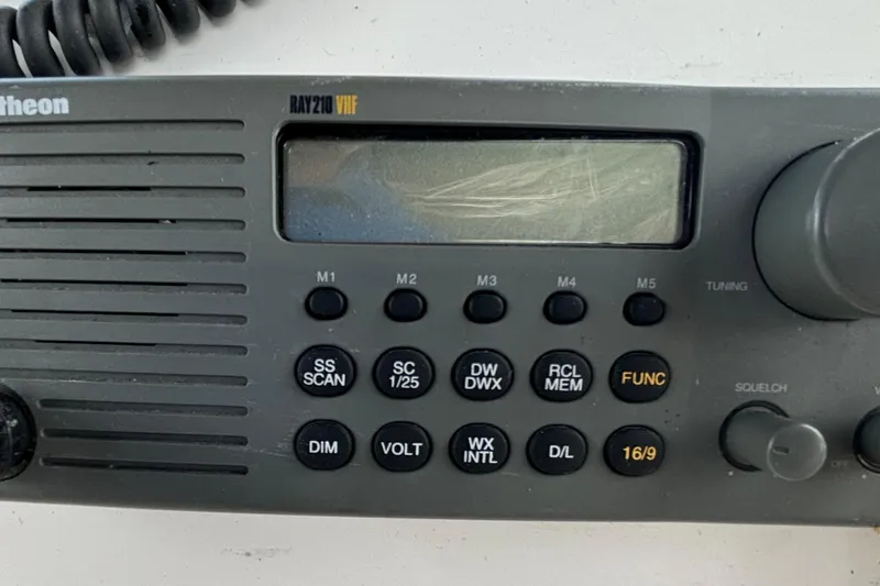 Slide: The Image of Raytheon RAY210 VHF radio on 1999 Silverton 453 Motor Yacht dashboard. - 23