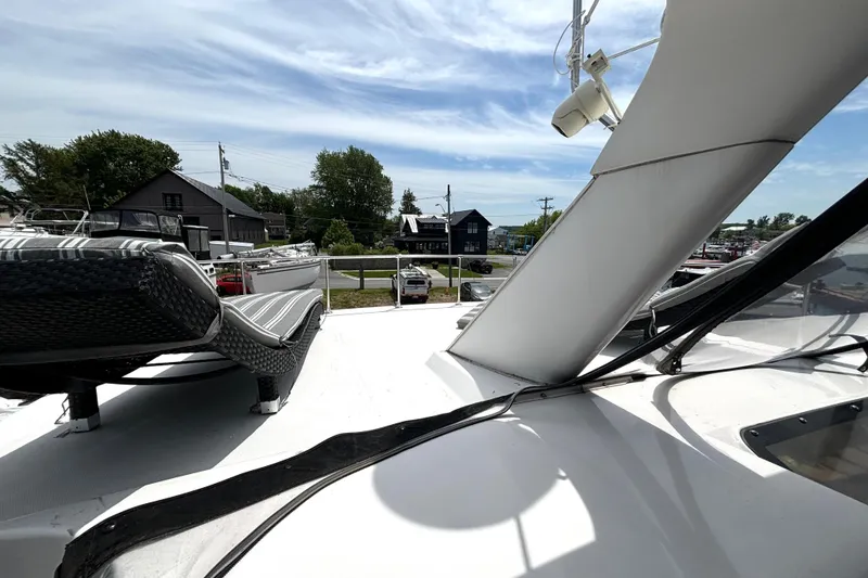 Slide: The Image of 1999 Silverton 453 Motor Yacht deck with lounge chairs, marina view. - 28