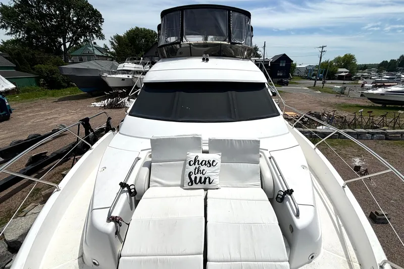 Slide: The Image of 1999 Silverton 453 Motor Yacht with sunbathing deck and "chase the sun" pillow. - 32