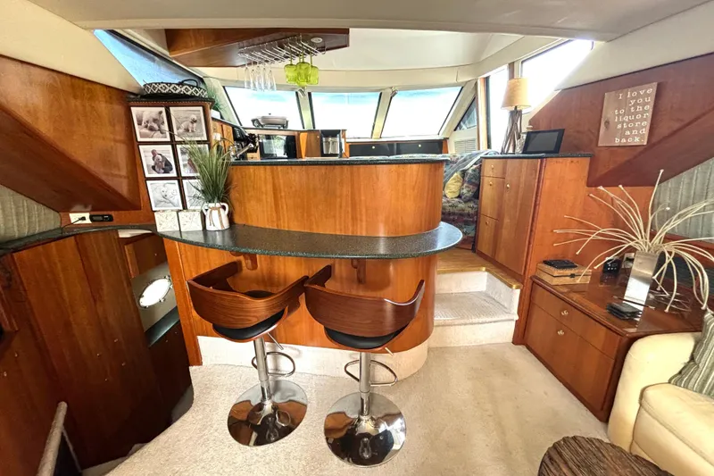 Slide: The Image of Interior of 1999 Silverton 453 Motor Yacht with stylish bar and seating area. - 40