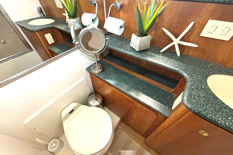 Slide: The Image of Bathroom interior of 1999 Silverton 453 Motor Yacht with modern fixtures and decor. - 50