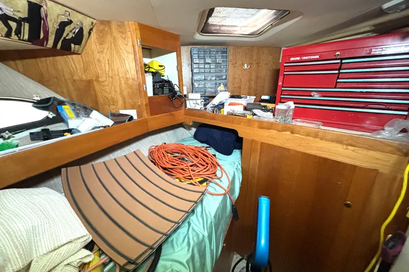 Slide: The Image of Interior of 1999 Silverton 453 Motor Yacht with tools and storage area. - 57