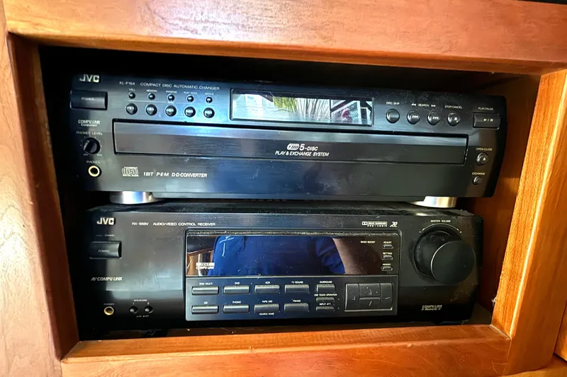 Slide: The Image of JVC audio system in 1999 Silverton 453 Motor Yacht, featuring CD changer and receiver. - 59