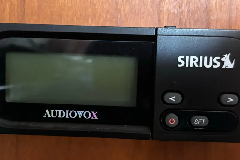 Slide: The Image of Audiovox Sirius radio unit on 1999 Silverton 453 Motor Yacht dashboard. - 62