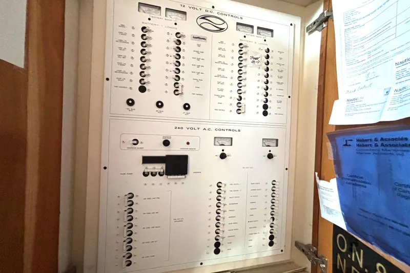 Slide: The Image of Electrical control panel on a 1999 Silverton 453 Motor Yacht, featuring 12V and 240V systems. - 65