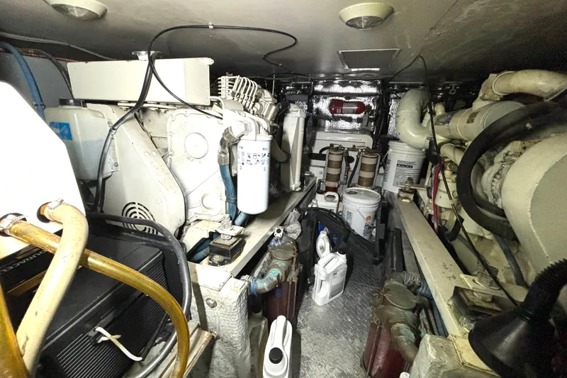 Slide: The Image of Engine room of a 1999 Silverton 453 Motor Yacht, showcasing machinery and equipment. - 66