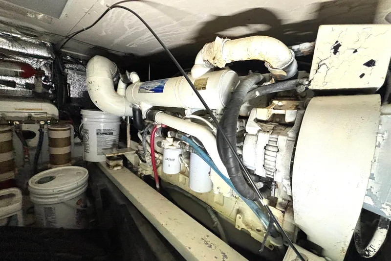 Slide: The Image of Engine room of a 1999 Silverton 453 Motor Yacht with visible components and equipment. - 67