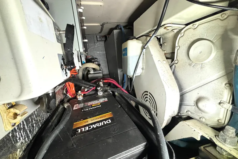 Slide: The Image of Engine compartment of a 1999 Silverton 453 Motor Yacht with visible battery and wiring. - 70