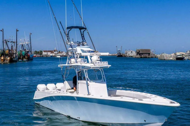 The Image of 2019 Concept 392 ProFish boat on calm water, with clear blue sky and harbor background. - 0