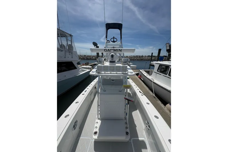 Slide: The Image of 2019 Concept 392 ProFish boat with Garmin equipment, docked at a marina under clear skies. - 12