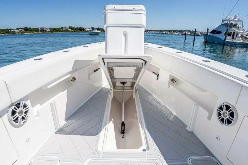Slide: The Image of 2019 Concept 392 ProFish boat interior with open storage, speakers, and ocean view. - 18