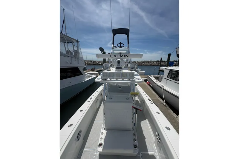 Slide: The Image of 2019 Concept 392 ProFish boat docked, featuring advanced Garmin navigation equipment. - 23