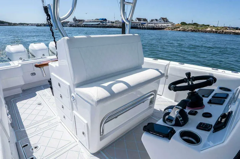 Slide: The Image of 2019 Concept 392 ProFish boat interior with helm, seating, and ocean view. - 24