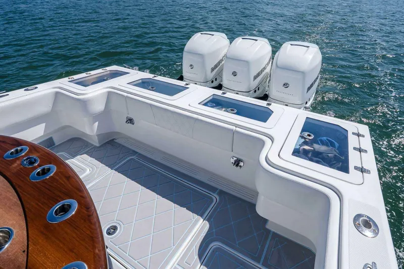 Slide: The Image of 2019 Concept 392 ProFish boat with triple Mercury engines on open water. - 26
