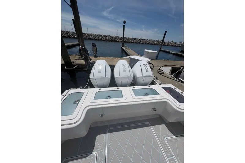 Slide: The Image of 2019 Concept 392 ProFish boat with triple outboard engines at dock. - 27