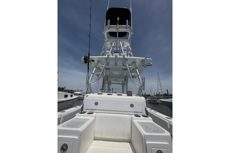 Slide: The Image of 2019 Concept 392 ProFish boat with tower, docked under clear sky. - 28
