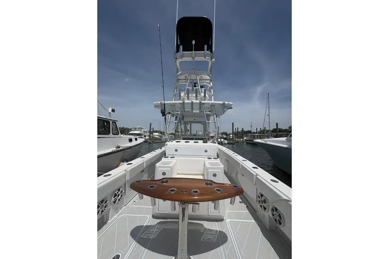 Slide: The Image of 2019 Concept 392 ProFish boat interior with fishing rod holders and tower, docked at marina. - 29