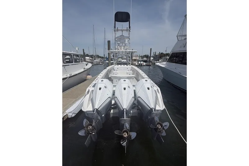 Slide: The Image of 2019 Concept 392 ProFish boat with triple outboard engines docked at marina. - 4