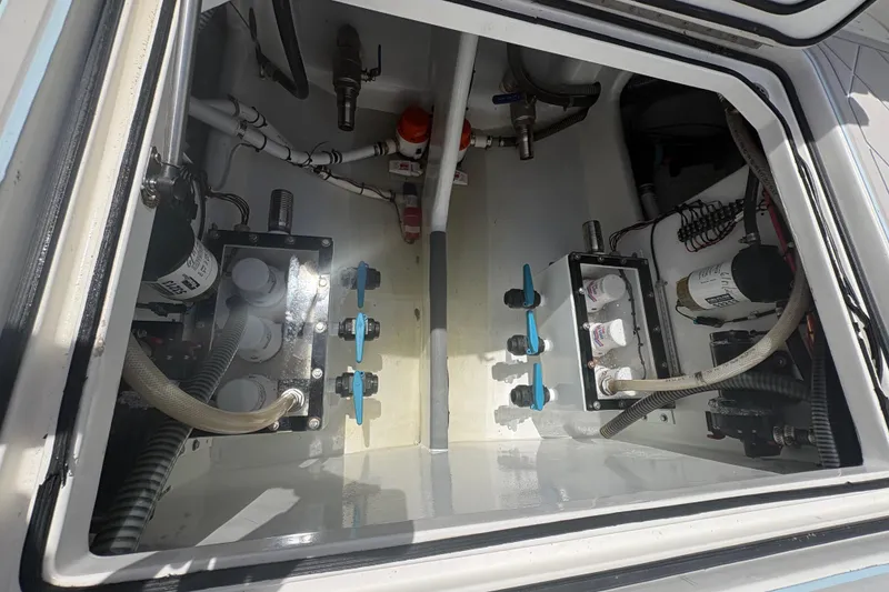 Slide: The Image of Engine compartment of 2019 Concept 392 ProFish boat, showcasing mechanical components and hoses. - 40