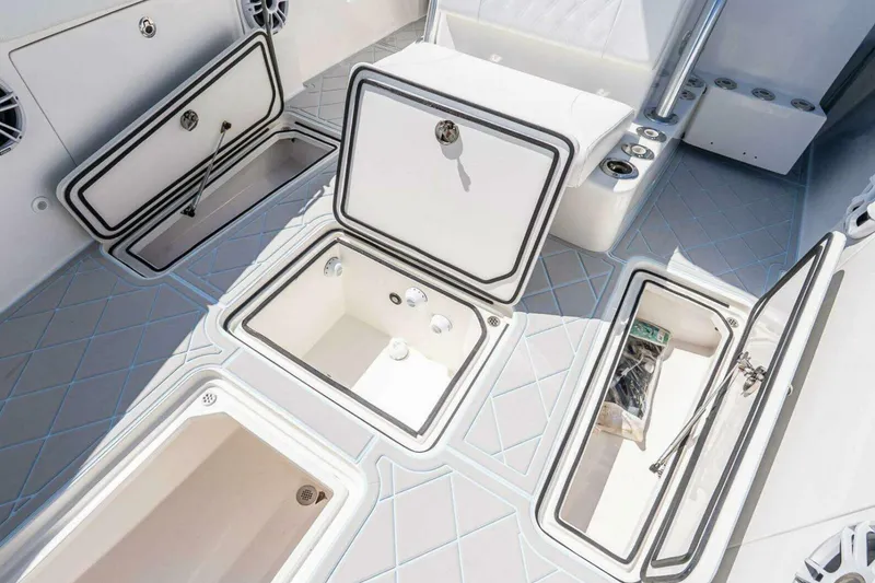 Slide: The Image of 2019 Concept 392 ProFish boat deck with multiple open storage compartments. - 45